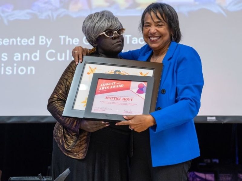 Mattice Hoyt was presented the Arts Patron award in 2024. Here she is shown being presented the award by then Mayor Woodards. 