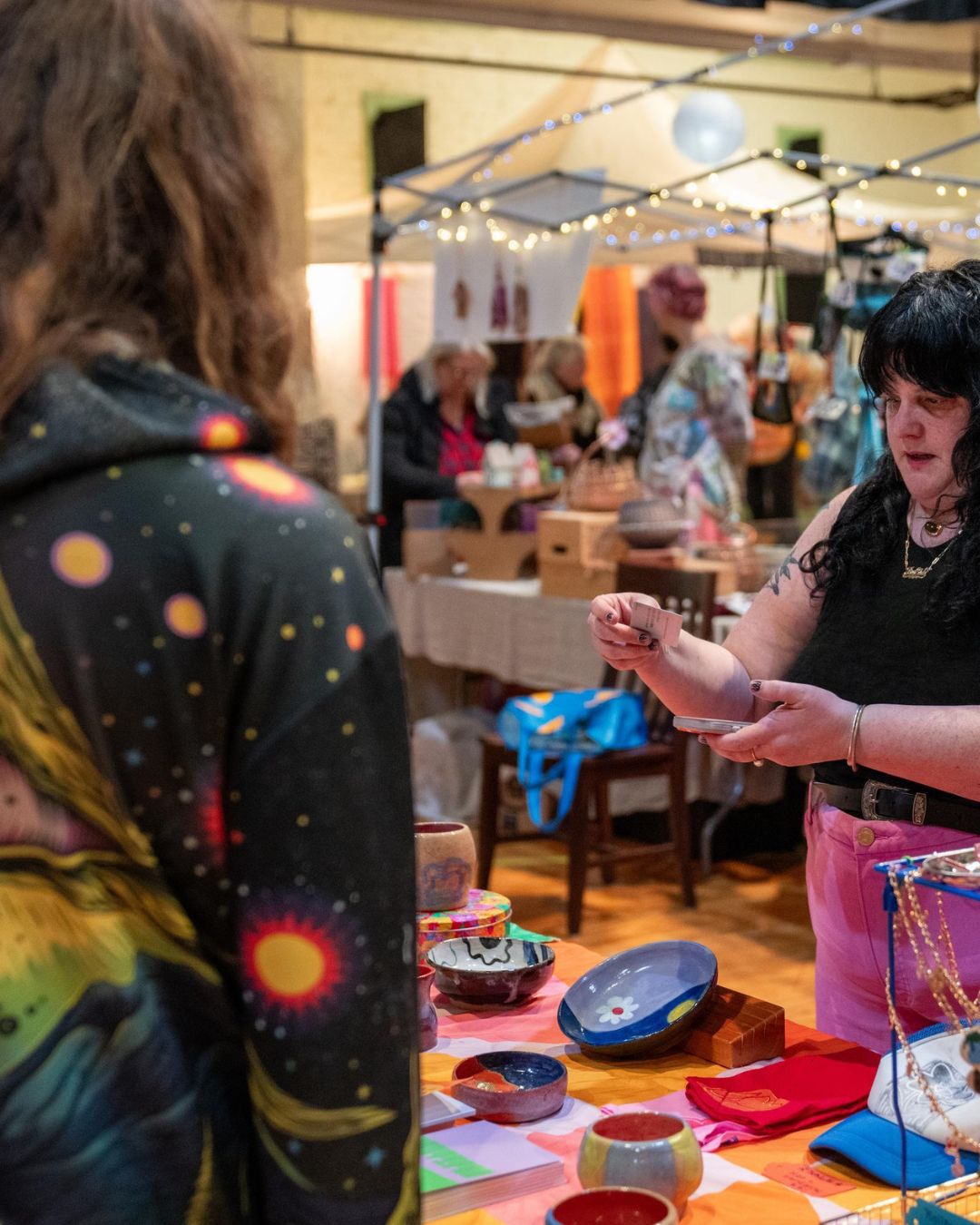 Artist Julie Baldock of Xeric Ceramics shows off her creations at Arts at the Armory inside the historic Tacoma Armory. 